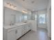 Modern bathroom features a double vanity, a large mirror, and a glass-enclosed shower at 175 Darby Meadow Ln, Ridgeville, SC 29472