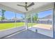 Inviting screened porch with a ceiling fan offers views of the spacious backyard at 175 Darby Meadow Ln, Ridgeville, SC 29472