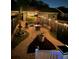 Backyard patio with elegant pavers, ambient string lighting and patio furniture perfect for outdoor entertaining at 1852 Pierce St, Charleston, SC 29492
