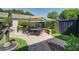 Private backyard featuring a patio area with outdoor dining set and mature landscaping at 1852 Pierce St, Charleston, SC 29492