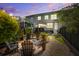 Inviting backyard featuring a fire pit, patio furniture and manicured landscaping and lovely pavers at 1852 Pierce St, Charleston, SC 29492