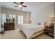 Cozy bedroom featuring white bedding, shuttered windows, side tables, and stylish decor at 1852 Pierce St, Charleston, SC 29492