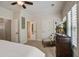 Bright bedroom with white walls, neutral carpet, fan, and natural light from shuttered windows at 1852 Pierce St, Charleston, SC 29492