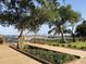Beautiful boardwalk with green landscaping and a view of the water at 1852 Pierce St, Charleston, SC 29492