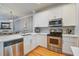 Well-appointed kitchen with stainless steel appliances, white cabinets, and granite countertops at 1852 Pierce St, Charleston, SC 29492
