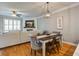 Cozy open-concept living room with hardwood floors and a fireplace, ideal for entertaining at 1852 Pierce St, Charleston, SC 29492