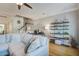 Comfortable living room with a large sectional sofa, stylish shelving, and hardwood floors at 1852 Pierce St, Charleston, SC 29492