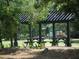 Lovely community picnic area with covered tables and a playground, ideal for outdoor gatherings and Gathering fun at 1852 Pierce St, Charleston, SC 29492