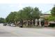 Beautiful street view with mature trees, sidewalks, and well-maintained storefronts with ample parking at 1852 Pierce St, Charleston, SC 29492