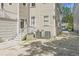 Exterior backyard featuring a two-story home with a gravel drive at 19 Smith St # A, Charleston, SC 29401