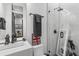 Modern bathroom with sleek glass shower, square sink, and black hardware accents at 19 Smith St # A, Charleston, SC 29401