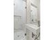 Modern bathroom with white marble walls and glass shower at 19 Smith St # A, Charleston, SC 29401