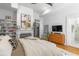 Cozy bedroom features neutral decor, hardwood floors and modern amenities at 19 Smith St # A, Charleston, SC 29401