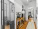 Bright hallway featuring wood floors and stylish furniture at 19 Smith St # A, Charleston, SC 29401