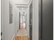 Hallway with hardwood floors leading to a bright, well-lit area at 19 Smith St # A, Charleston, SC 29401