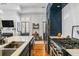 Open concept kitchen with stainless steel appliances and view to the living room at 19 Smith St # A, Charleston, SC 29401