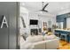 Inviting living room with fireplace opening to the kitchen area at 19 Smith St # A, Charleston, SC 29401