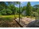 Expansive backyard featuring a wooden deck, lush greenery, mature trees, and an inviting atmosphere at 1918 Piper Dr, Charleston, SC 29407