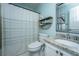 Charming bathroom with granite countertop, framed mirror, and decorative shelving, and shower curtain at 1918 Piper Dr, Charleston, SC 29407