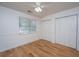 Well-lit bedroom with hardwood floors and ample closet space, offering a comfortable retreat at 1918 Piper Dr, Charleston, SC 29407