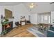 Spacious living room featuring hardwood floors, a fireplace, comfortable seating, and a vaulted ceiling at 1918 Piper Dr, Charleston, SC 29407
