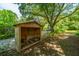 Backyard wood storage sits among the lush foliage and mature trees, great for firewood at 1918 Piper Dr, Charleston, SC 29407