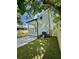 Backyard view of the rear of a house with porch, siding, air conditioner, fence, and green lawn at 1991 Joppa Ave, North Charleston, SC 29405
