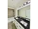Modern bathroom featuring a double vanity with black countertops and sleek fixtures at 1991 Joppa Ave, North Charleston, SC 29405