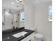 Elegant bathroom featuring a dual sink vanity with a black marble countertop at 1991 Joppa Ave, North Charleston, SC 29405