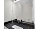 Modern bathroom vanity with black marble countertop, white sink, matte black faucet, and white walls at 1991 Joppa Ave, North Charleston, SC 29405