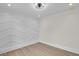 Well-lit bedroom featuring a modern accent wall and neutral flooring at 1991 Joppa Ave, North Charleston, SC 29405