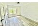 Bright bedroom with modern light fixture, wood floors, and decorative wall at 1991 Joppa Ave, North Charleston, SC 29405