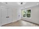 Bright bedroom with large windows, closet and modern ceiling fan at 1991 Joppa Ave, North Charleston, SC 29405