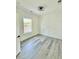 Bright bedroom with modern light fixture, wood floors, and decorative wall at 1991 Joppa Ave, North Charleston, SC 29405