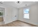 Bright, airy bedroom with panel doors and a window showcasing a view of the outdoors at 1991 Joppa Ave, North Charleston, SC 29405