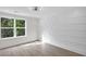 Bedroom with large window with view and a decorative, modern accent wall at 1991 Joppa Ave, North Charleston, SC 29405