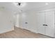 Bright bedroom with clean walls, modern lighting, and two panel doors, offering a serene retreat at 1991 Joppa Ave, North Charleston, SC 29405