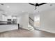 Open concept living room connects the kitchen and the staircase, and boasts recessed lighting at 1991 Joppa Ave, North Charleston, SC 29405
