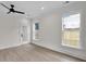 Living room with modern floors, a ceiling fan, recessed lights and a view to the outdoors at 1991 Joppa Ave, North Charleston, SC 29405