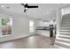 Spacious living room with modern floors and a view to the kitchen and stairs at 1991 Joppa Ave, North Charleston, SC 29405