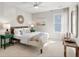 Cozy bedroom featuring neutral decor, green side tables and a ceiling fan at 200 Bear Oak Ct, Moncks Corner, SC 29461
