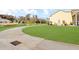 Sprawling backyard with patio, lawn, and a view of the pond create a tranquil setting at 203 Oak View Way, Summerville, SC 29483