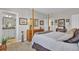 Bedroom features a four-poster bed, and an adjacent bathroom, creating a private retreat at 203 Oak View Way, Summerville, SC 29483