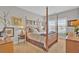 Bedroom with a four poster bed, neutral decor, and natural light from windows at 203 Oak View Way, Summerville, SC 29483
