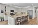 Spacious kitchen with an island, breakfast bar, stainless steel appliances, and ample cabinet space at 203 Oak View Way, Summerville, SC 29483