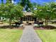 A peaceful community park offers benches and a covered pavilion, perfect for relaxation at 203 Oak View Way, Summerville, SC 29483