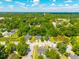 Expansive aerial shot capturing a neighborhood surrounded by lush greenery and a serene pond at 207 Allen Richard Ct # B, Moncks Corner, SC 29461