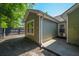 View of the home's backyard and olive green siding, window and back door to the home at 207 Allen Richard Ct # B, Moncks Corner, SC 29461
