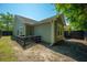Backyard of home with olive green siding, dark wooden fence and grassy yard at 207 Allen Richard Ct # B, Moncks Corner, SC 29461
