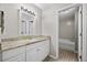 A bathroom with white vanity, granite countertops, modern mirror and views of the tub at 207 Allen Richard Ct # B, Moncks Corner, SC 29461